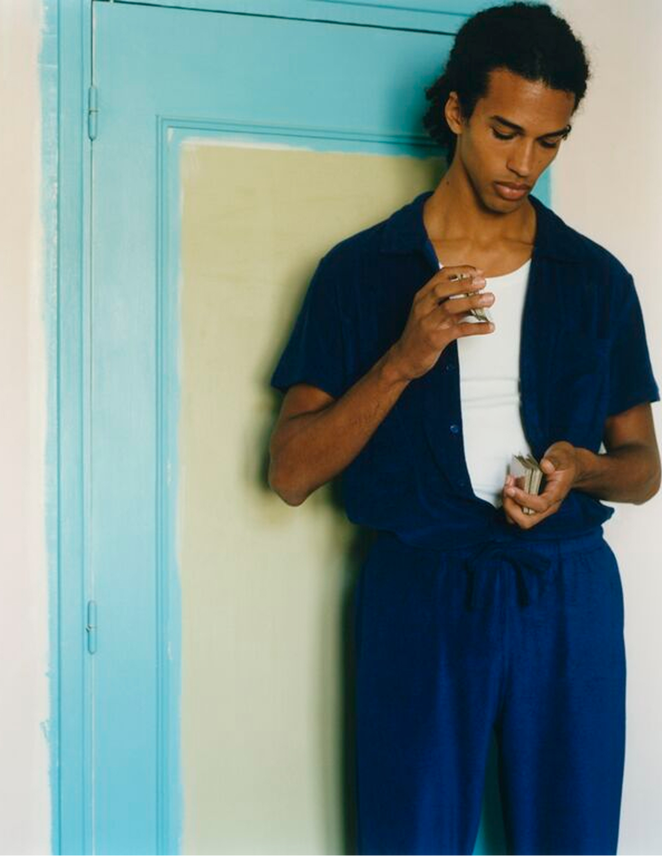 Man standing with cards in his hands